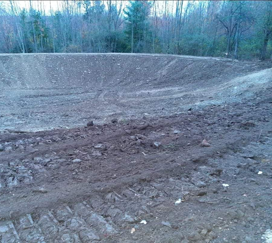 A giant tractor left it's mark on the soil while grading.