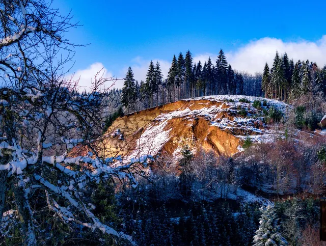 An excavation site sits peacefully, frosted over from the winter snow. Spring will be there soon and it will be time to work again!
