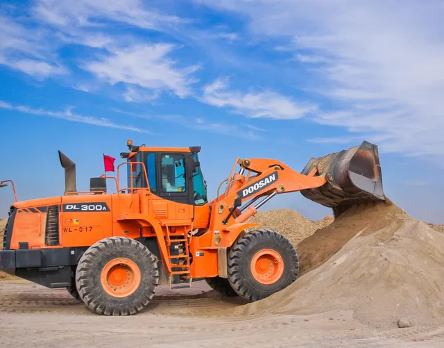 Doosan tractor makes moving sand easy.