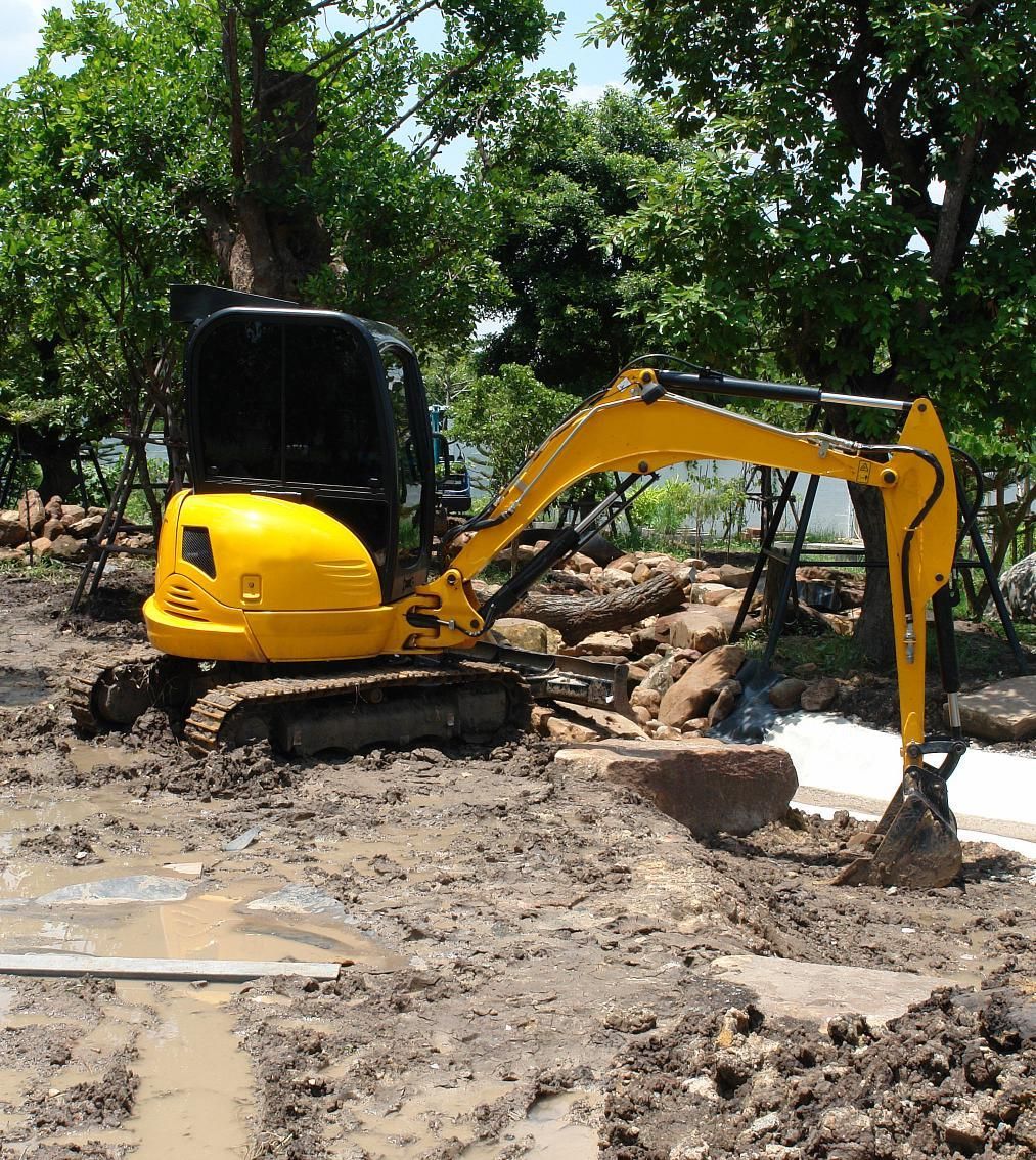 a yellow excavator with the word jcb on the front