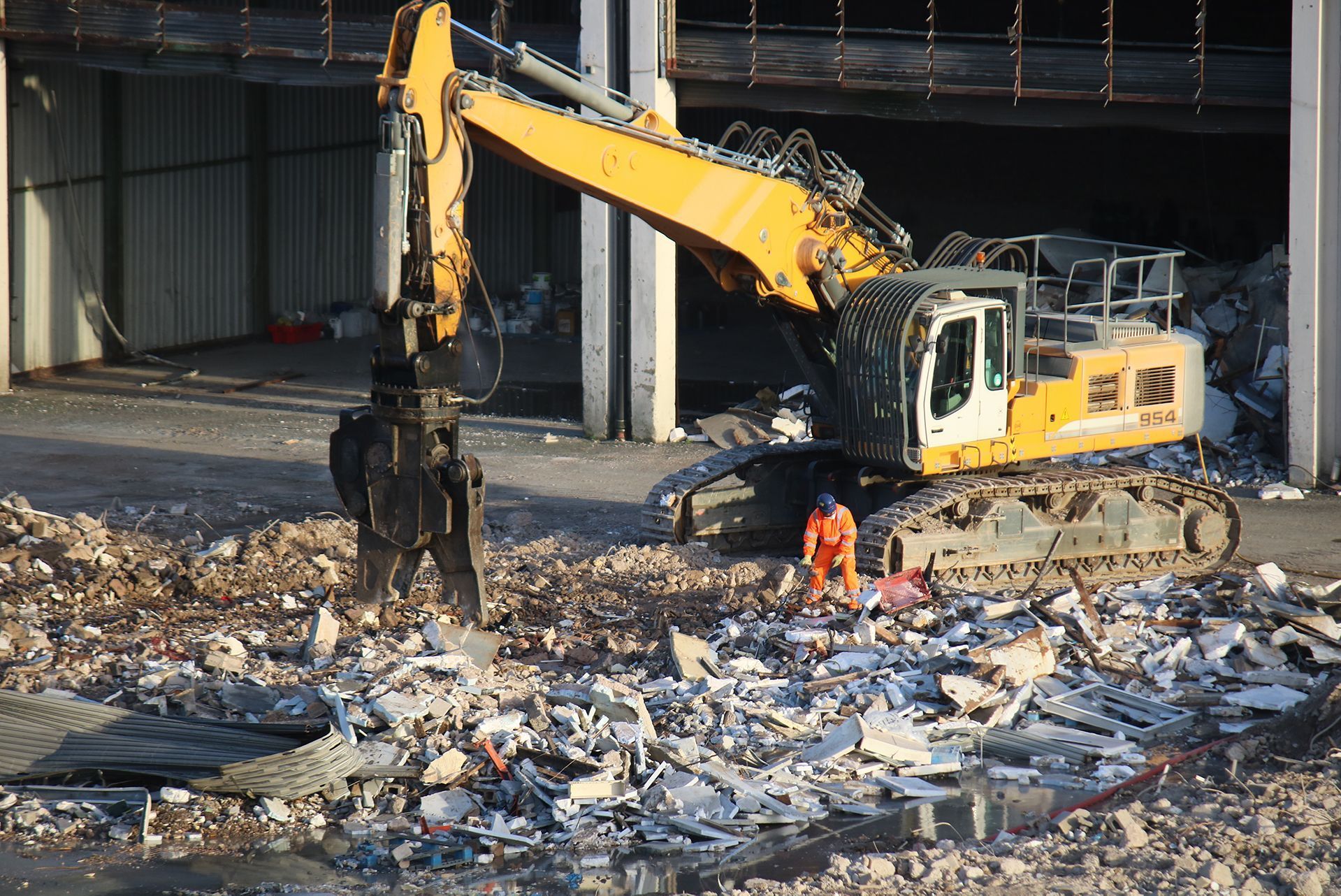 a large yellow excavator with the number 956 on it